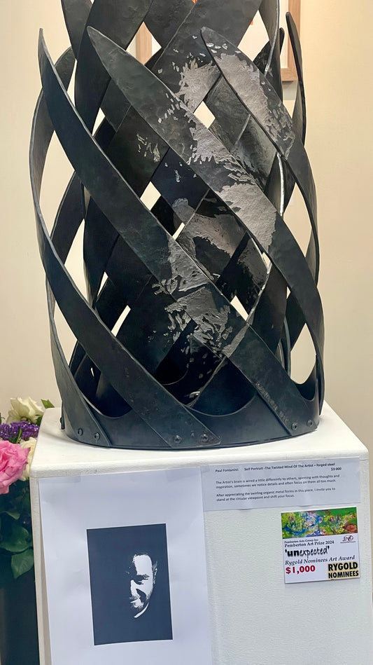 forged steel sculpture with anamorphic self portrait