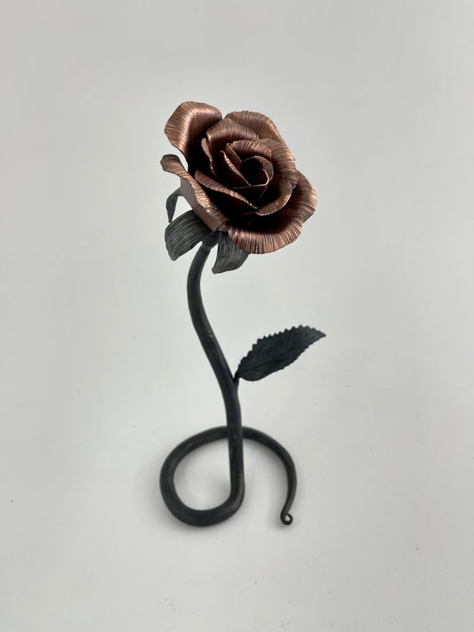Copper and steel rose with scrolled base